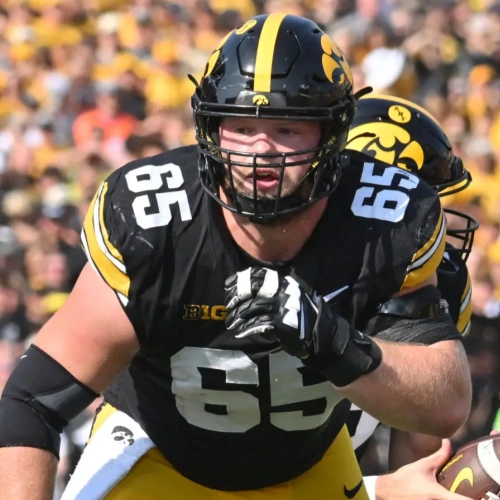 Men Youth Iowa Hawkeyes #65 Logan Jones Nike Black College Football Game Jersey